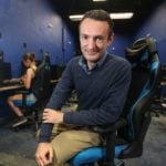 Agragati Siegel, founder and CEO of GameSync, featured by San Diego Business Journal at an esports center.